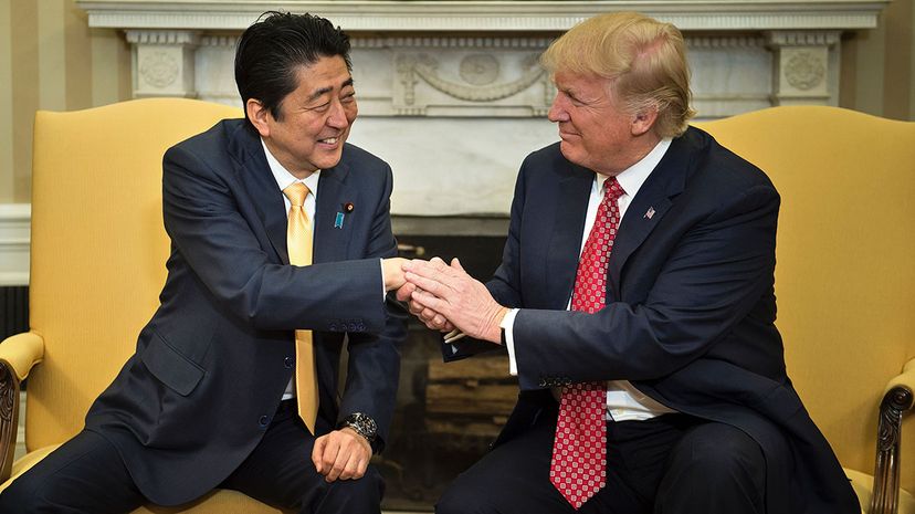Japan's Prime Minister Shinzo Abe and Trump shake hands before a meeting in the Oval Office of the White House on Feb. 10, 2017. Based on this snapshot, it's hard to tell that anything strange is going down with the Abe-Trump handshake.