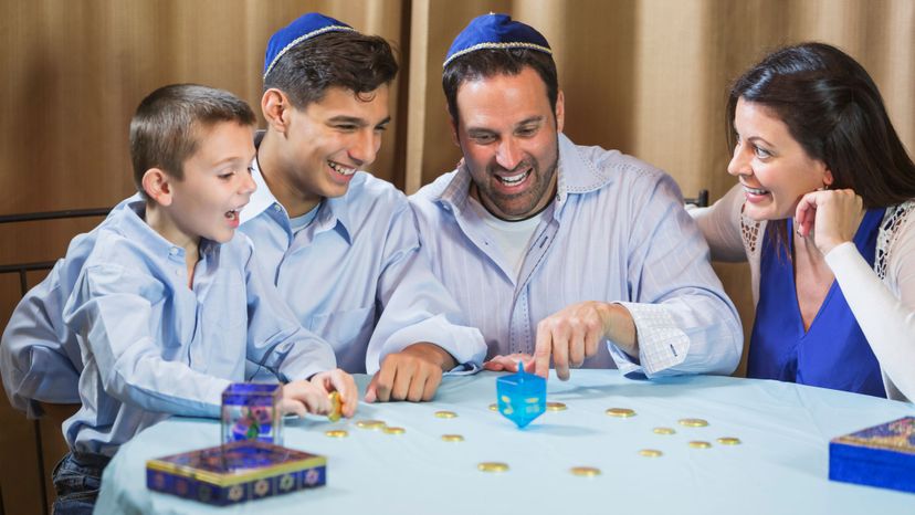 People playing with dreidels