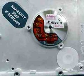 Warning sticker on a hard disk stating "Warranty Void If Removed".