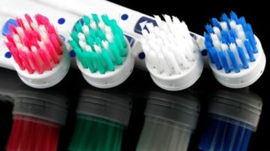 Does a hard toothbrush destroy enamel?