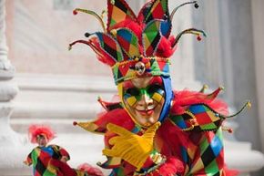 小丑在威尼斯狂欢节”width=