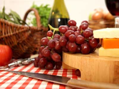 red grapes with cheese and wine glass.