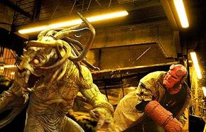 Hellboy (Ron Perlman - right) does battle with the unstoppable creature Sammael (Brian Steele - left).
