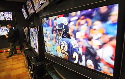 A shopper inspects HD televisions in a Circuit City store January 29, 2008 in New York City. 