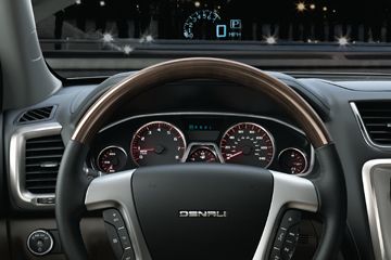 The 2012 GMC Acadia's heads-up display allows drivers to safety merge onto the highway using technology similar to what fighter pilots use to guide precise movements at supersonic speeds.