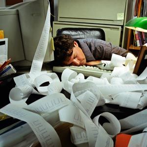 man asleep on desk