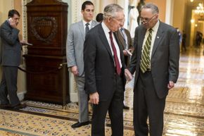 Senate Majority Leader Harry Reid, D-Nev., and Sen. Charles Schumer, D-N.Y. on Nov. 14, 2013 as they leave the Senate Democrats' meeting on Obamacare with White House Chief of Staff Denis McDonough.