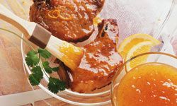 Pork chops being marinated with citrus