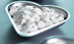 heart-shaped dish of pills