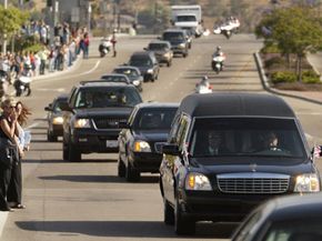 Mourners line the road in Camarillo, Calif., as the hearse carrying former President Ronald Reagan's casket passes on June 9, 2004.