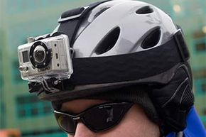 A man wears a ski helmet with the GoPro camera attached to it.