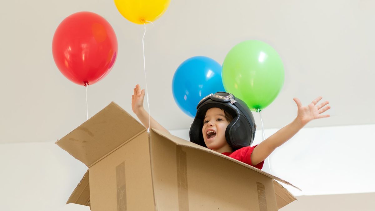 holding lots of balloons