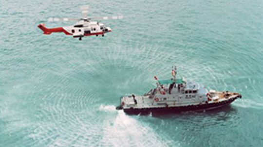 How do helicopters film crab boats in rough weather?