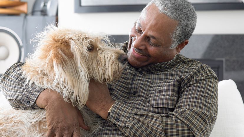 Man holds his pet dog