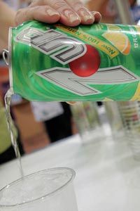 The makers of 7Up, which includes high-fructose corn syrup as an ingredient, dropped their claim that the product was &quot;all natural&quot; after being threatened with a lawsuit by a consumer advocacy group.