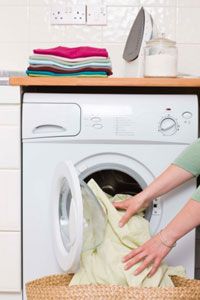 Woman unloading dryer