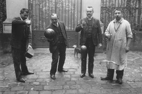 A group of men play cup and ball in 1906.