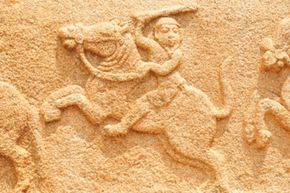 A stone carving of a warrior