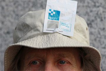 protesters with bag of medical cannabis on his head