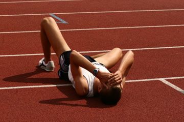 Athlete running on sports track, living active lifestyles.