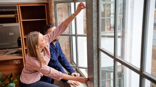 woman measuring window