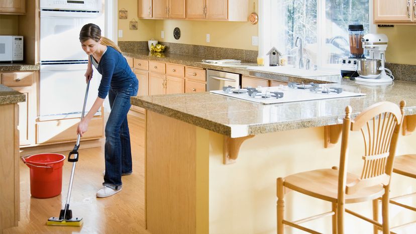 teen mopping floor