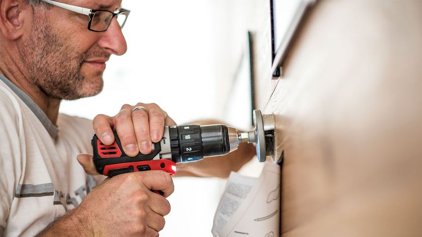 handyman using a drilling machine