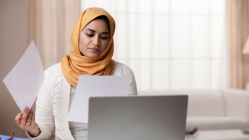 Woman in hijab at computer