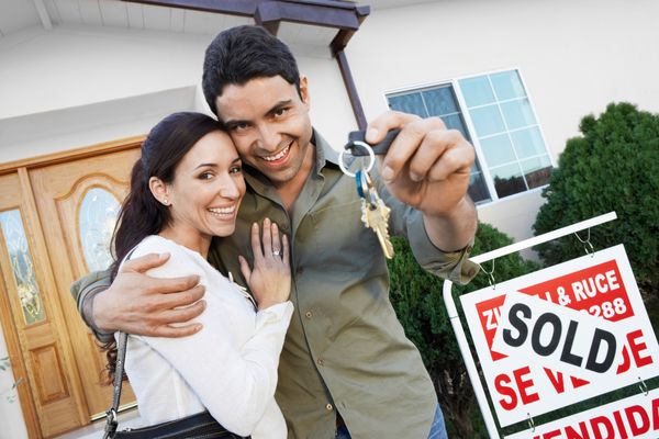 couple holding house keys