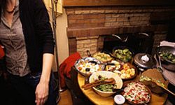 Despite the guest list and volume of food, hosting a potluck is easier than you'd think.