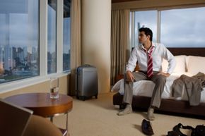 Man relaxing in posh hotel room.