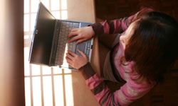 Woman in hotel on computer