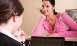 Woman at hotel desk