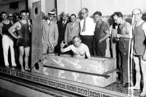 Harry Houdini prepares for a coffin escape stunt in 1926.