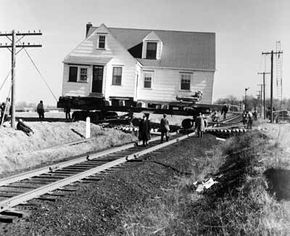 Moving a house over obstacles such as railroad tracks can add significantly to the costs.