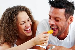 couple laughing and eating