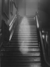 The â€œBrown Ladyâ€ descending the staircase at Raynham Hall in Norfolk, England.