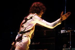 Jimmy Page of Led Zeppelin rocks a theremin during a concert in 1977.