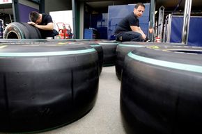 Red Bull technicians check race tires in preparation for the Formula One race at Albert Park in Melbourne, Australia.