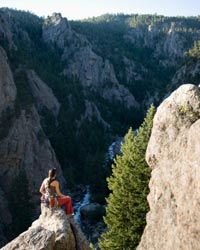 Giving your images some content -- like a wide background of mountain trees -- can make a rock climbing photo more successful.