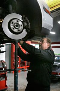 Mechanic Ed Wuerth works on a Volvo at his shop, Wuerth Automotive, in Brownstown Township, Mich.