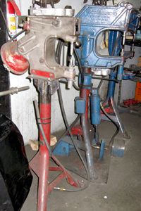 A pneumatic (left) and a mechanical or foot-stomp riveter side by side. They're nearly identical.