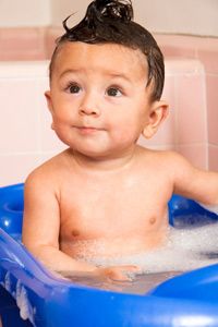Cute baby in baby bath.