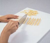 Cut the dough into strips of desired width.