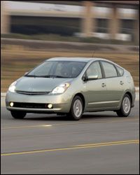 A Toyota Prius driving on the highway.