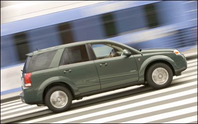 Saturn Vue Greenline driving on a highway.