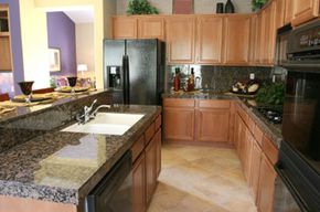 A refacing job can give you lovely, new-looking cabinets like these. See more pictures of kitchen decor.