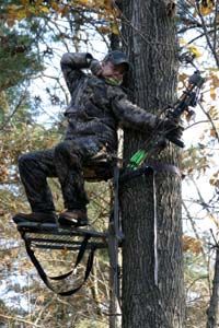 bow hunter on a tree stand