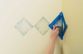 For an inside corner, mask off the second wall and let that part of the stencil hang free while you work the first wall.