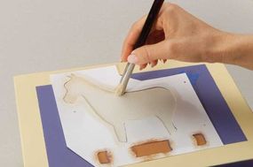 Stencil the horse's body with a 5/8-inch brush.